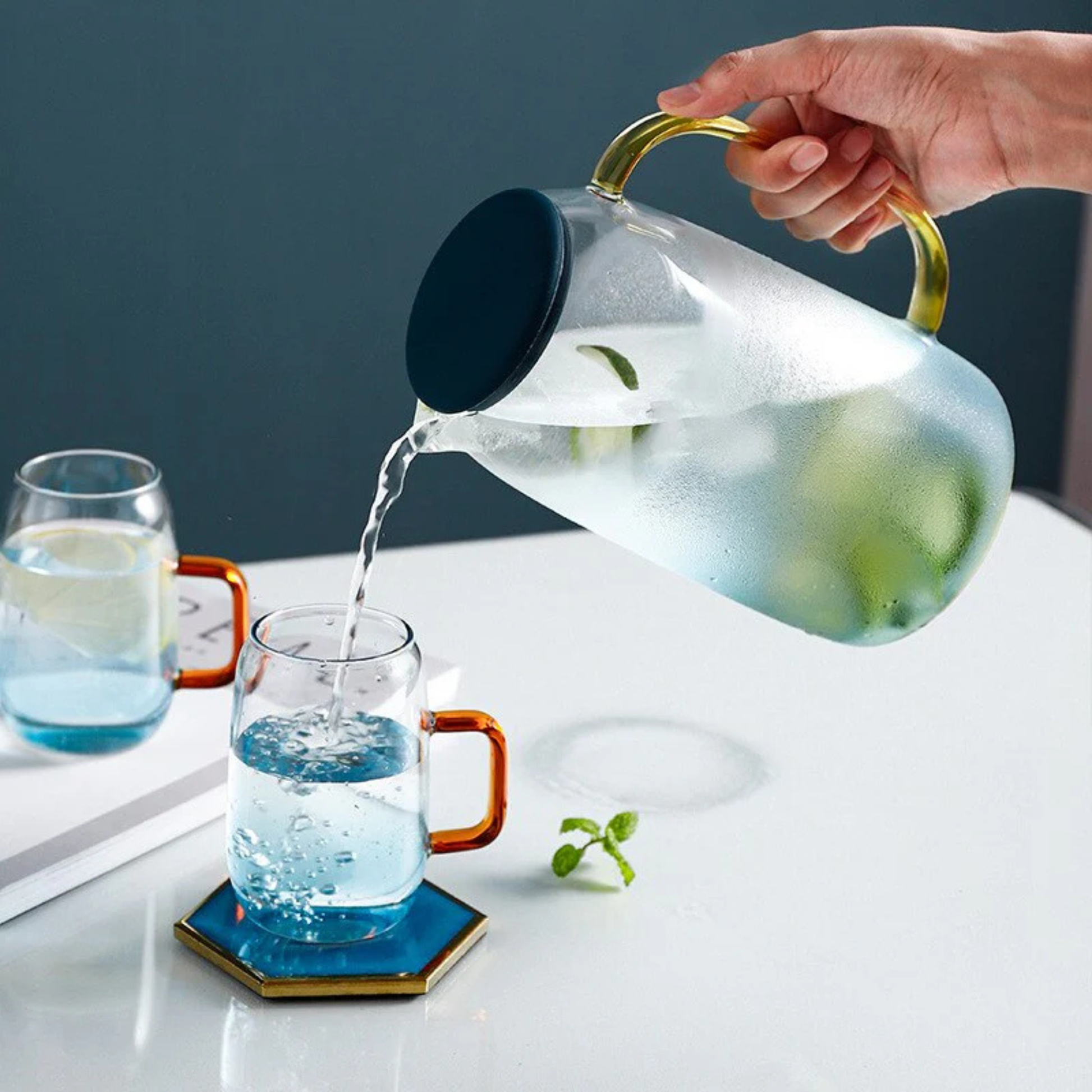 Heat resistant glass pitcher with handle and lid